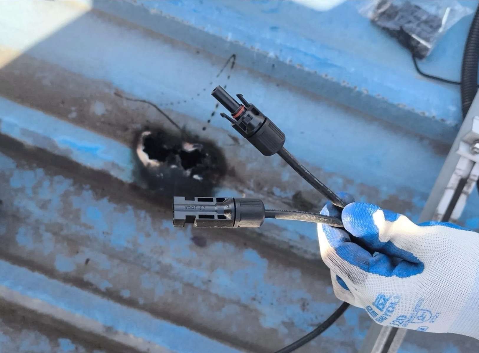 Technician repairing damaged solar connector